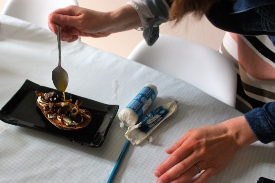 drizzling the garlic dressing